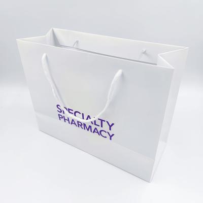 China New Arrival Factory Wholesale Hot Silver Stamping Custom Pharmacy Paper Bags With Ropes for sale