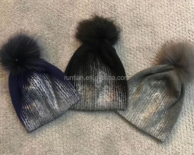 China JOINT hot sale fashion raccoon fur pompom hats knitting women's metallic foil print hats for sale