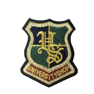 China New Viable Design Wholesale Embroidery Patch Badge Yarn Customized Gold Garment Decorative Iron On Embroidery Patch for sale