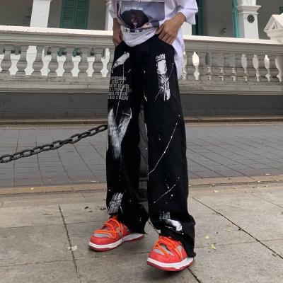 China 2022 European anti-pilling and American trend fried street pi workshop Guochao street print splatter ink letter graffiti Girls Hip Hop pants for sale