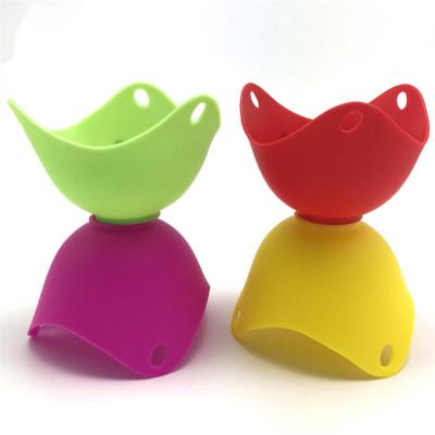 China Sustainable Kitchen Cooking Non Stick 4pcs/boxes Egg Poacher Pod Cup Silicone Egg Poacher for sale