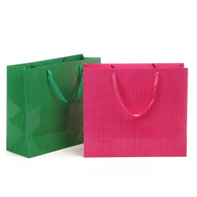 China Art paper material glossy laminated striped paper bag mini bags with ribbon rope for sale