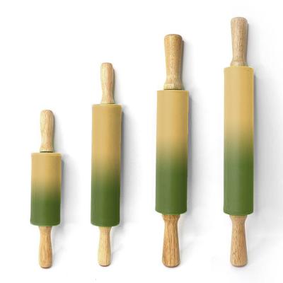 China Sustainable Baking Tools Non-Stick Food Flour Stick Solid Wooden Handle Roller Dumpling Sticks Silicone Pin for sale