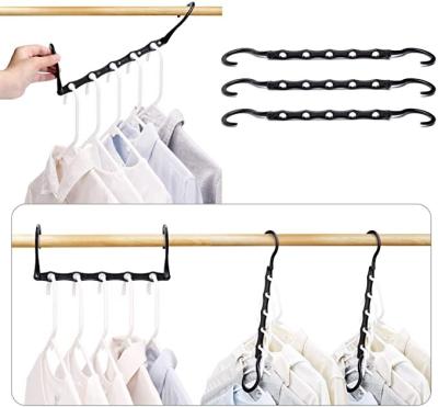 China Modern 9 Hole Coat Hanger Multifunctional Folding Plastic Hanger Rotating Magic Clothes Organizer Shelf Storage Hanger Rack for sale