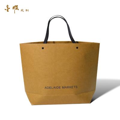 China Recyclable Hot Sales Wholesale Personalized Orange Luxury Kraft Paper Bag For Clothing Packaging for sale