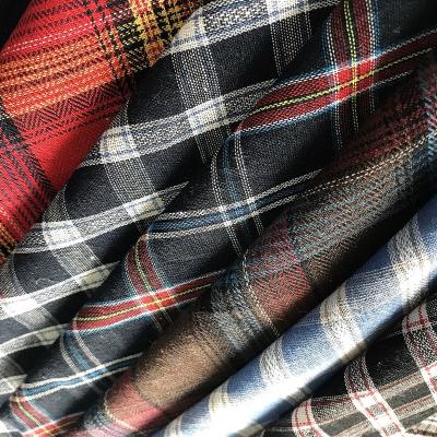 China Warehouse Cheapest Stock Polyester Cotton Yarns Shrink-Resistant Dyed Plaid Shirt Fabric Woven Lot Stock Coating / Shirting for sale