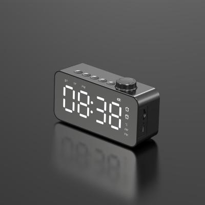 China New Design LED Alarm Clock Desktop Mirror Alarm Bass Speaker Backlight Wireless Digital Wireless Speaker for sale