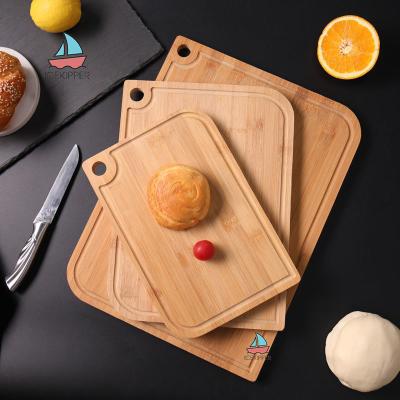 China Sustainable Custom Kitchen Reversible Butcher Block Bamboo Cutting Board 3 in 1 Chopping Board Set with Juice Groove for sale