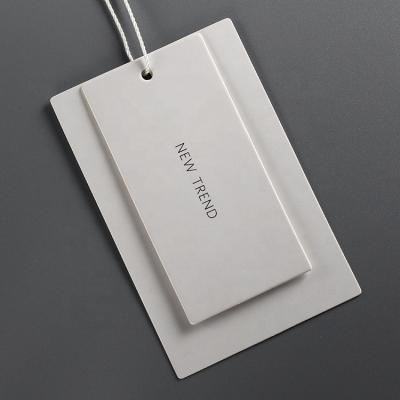 China Sustainable Custom Swing Hang Tags New Label Designs Clothing Pant Logo Hang Tag Printing /Clothing Tags For Clothes for sale