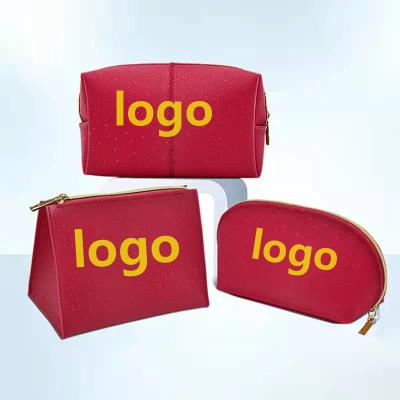 China Fashion Luxury TPU Makeup Bag 3 Pcs Waterproof Pearlescent Red Makeup Bag Set Custom Your Own Logo In Stock for sale