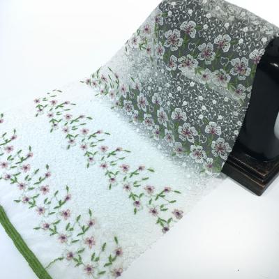 China Viable Custom Wholesale Knitted Elegant Small Flower White Flat Tulle Embroidery Fabric For Girl Dress for sale