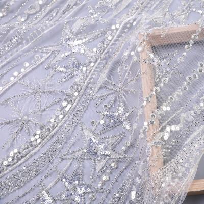 China Viable White Bridal French Lace Fabric Beaded Tulle Mesh Embroidery Sequin Fabric Star for sale