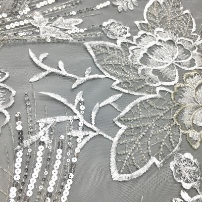 China New product fashion mesh floral design lace viable white bridal sequin machine beaded embroidery fabric for sale