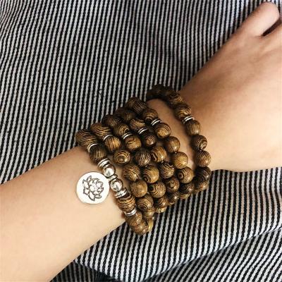 China Buddhist Wooden Tasbih Pendant 108 Mala Unisex Bracelet With Lotus Healing Bracelet Natural Sandalwood Buddha Prayer Bead for sale