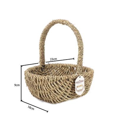 China Wholesale High Quality Handmade Environmental Hot Selling Iron Frame + Storage Basket Household Goods Seaweed Woven Snack Fruit Storage Basket for sale