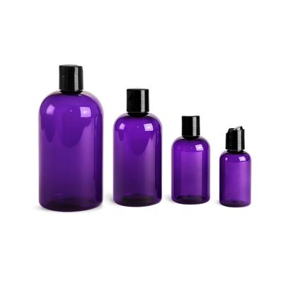 China Cosmetic Purple PET Boston Round Bottles With Black Disc Top Covers Unique Plastic Bottle for sale