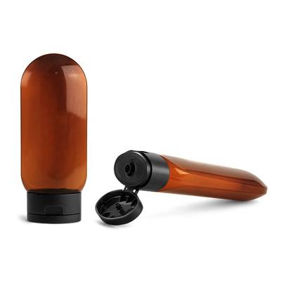 China Non Spill Plastic Bottles Amber PET Tottles With Black Snap Top Covers Unique Plastic Bottle for sale