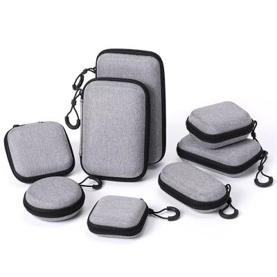 China OEM/ODM Friendly Waterproof Shockproof Dustproof Customize Mini Round Hard Earphone Case EVA Carrying Earphone Bag for sale