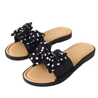 China Bowknot Trend Fashion Women's Outer Flower Beach Slippers Women's Wear Flat Sandals for sale