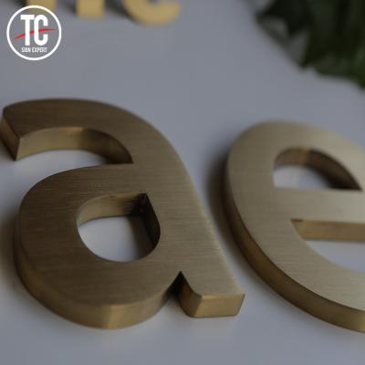 China Buildings Custom Solid Brushed Gold Metal Signage For Building Company Name for sale