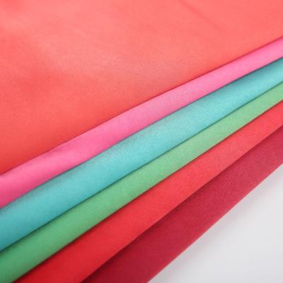 China Best Manufacturer Anti-Static Silky Fabrics Plain Dyed Pink Poly Satin Dye Fabric For Dress for sale