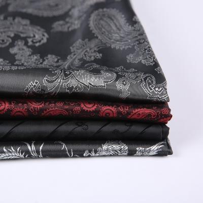 China Flower design luxury anti-static polyester viscose black jacquard fabric price per meter jacquard striping fabric for women for sale