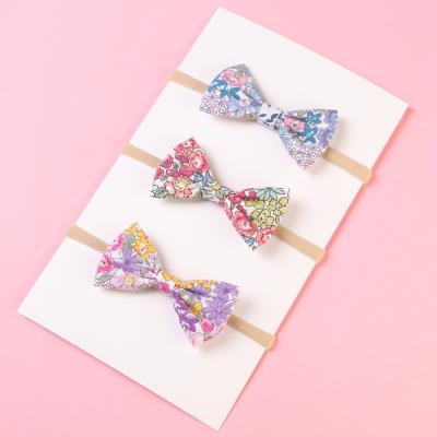 China Beautiful and Fashion Hair Accessories Baby Headband Accessories Printed Bow Flower Tricolor Elastic Hairband Stretch Head Flower Turban for sale