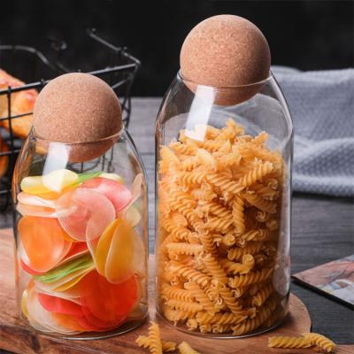 China Hot Selling Handmade High Freshness Preservation Borolicate Glass Bottle Glass Storage Jar With Round Cork Lid for sale