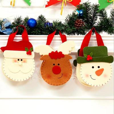 China Eco-friendly Decoration 3D Cartoon Christmas Santa Nonwoven Candy Felt Cute Christmas Gift Small Bag for sale