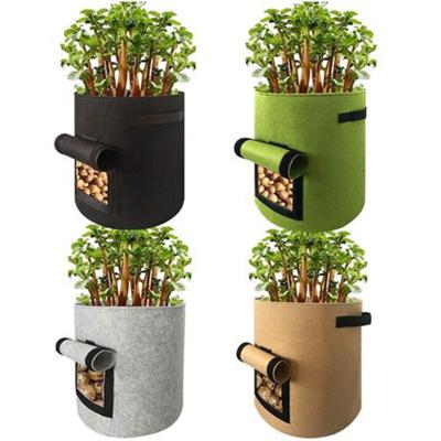 China Corrosion Resistance Not Garden Coated Large Black Fabric Nursery Potted Plant Planter Grow Bag With Handle for sale