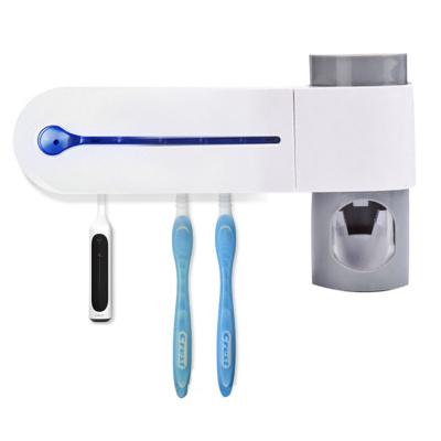 China ABS Multifunctional Toothbrush Sterilizer Disinfection Holder UV-C Toothpaste Dispenser for sale