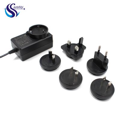 China Eu Interchangeable ABS+PC Plug Adapter Flame Retardant Material US Au British Power Adapter 24v 1a Power Supply 24w Charger For CCTV Camera for sale