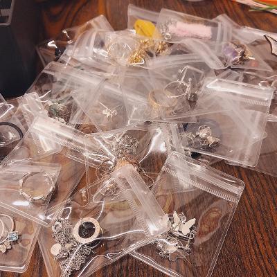 China Viable 100 Pcs Thickened Ring Earring Bracelet Storage Bag Jewelry Clear PVC Bag Sealed Bag for sale