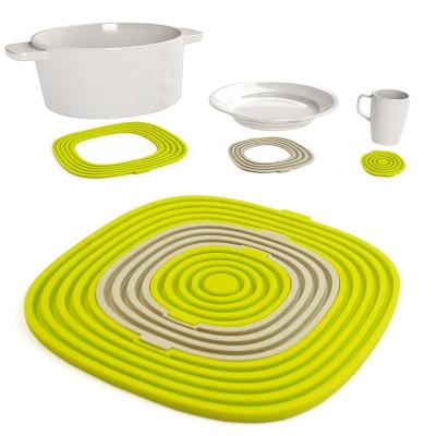 China Durable Hot Heavy Duty Silicone Pot Mat Non Slip Tripod Pads For Kitchen Table Place Mats for sale