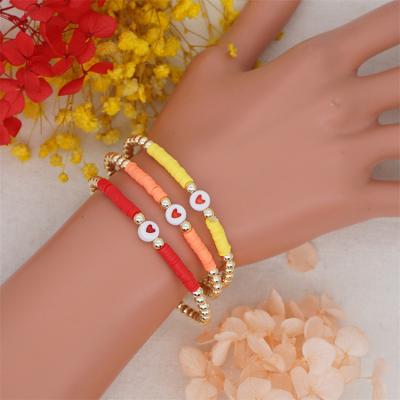 China 2021 BOHEMIA Ethnic Style Bohemian Colored Polymer Clay Heart Acrylic 4mm Gold Beaded Elastic Bracelet Women for sale