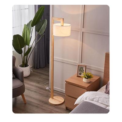 China Residential Simple Nordic Foot Switch Control Solid Wood Floor Lamps for sale