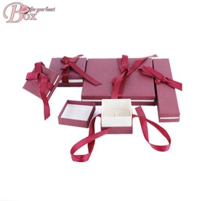 China Recycled Materials Wholesale Custom Printed Ribbon Bowknot Box Jewelry Logo Cardboard Luxury Jewelry Box for sale