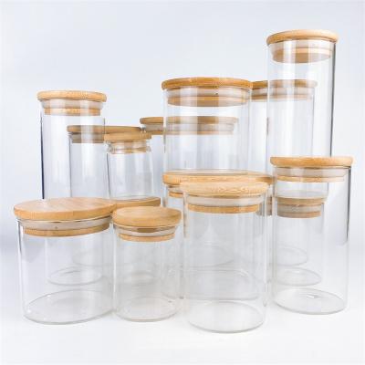 China 65mm Round Shape High Borosilicate Food Grade Nut Storage Box Reusable Factory Wholesale Free Sample Food Storage Glass Jar for sale