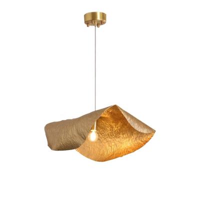 China UFO Postmodern Light Luxury Brass Simple Creative Bedroom Gold Living Room Lights Dining Room Pattern Designer Pendant Light for sale