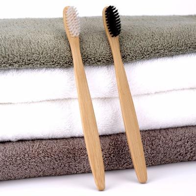 China Luxury Hotel Room Amenities Arc Design Smooth Surface Bamboo Toothbrushes for sale