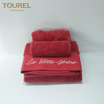 China La toalla de baño 100% fijada las toallas de la toalla de mano de la toalla de cara del hotel del algodón fija en venta