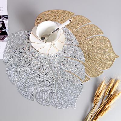 China Amazon Hot Selling Oilproof Leaves Shape Mat Golden Washable Table Rattan Dish Mat Dining Table Dish Decoration for sale