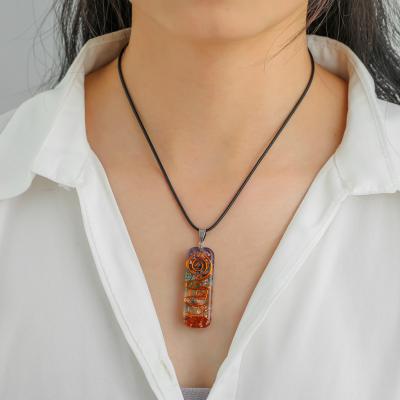 China NEULRY FASHIONABLE Wholesale Popular Women Colored Stone Crystal Resin Necklace Organ Energy Pendant for sale