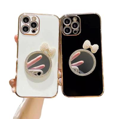 China Waterproof Makeup Mirror Bracket Phone Case Plating Soft Bow Mobile Phone Case For Iphone 11 and 12 Pro Pearl Diamond for sale