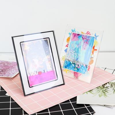 China 5*7 Inch Polybag And White Case Wanderer Home Photo Frame With Water With Stand PH-64 for sale