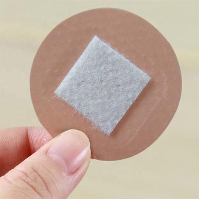 China Skin Color PE Children Pe Waterproof Small Round 22mm Round 22mm Custom Hemostasis Tape Circular Adhesive Plaster Medical Sterile Adhesive Plaster Aid for sale