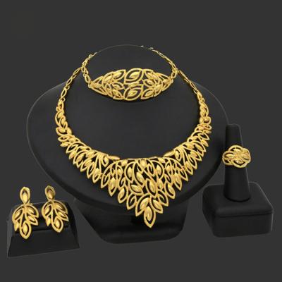 China Hot Sale India Religious Necklace Earrings Ring Bracelet Wedding Four Pakistani Gold Plated Fashion Dubai Fine Jewelry Sets for sale