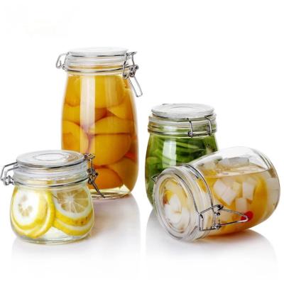 China Viable Wholesale Clear Round Storage Glass Jar With Flip Clip Top Glass Canning Hinged Jar for sale