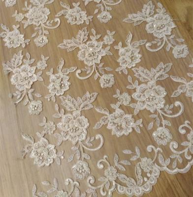 China Newest viable bridal lace design / beaded and tied embroidery fabric / textile fabrics lace up for dresses for sale