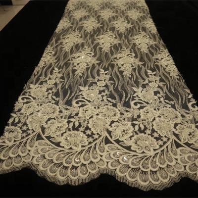 China Sustainable good quality luxury handwork beaded embroidery french bridal lace fabric with strings and sequins for sale